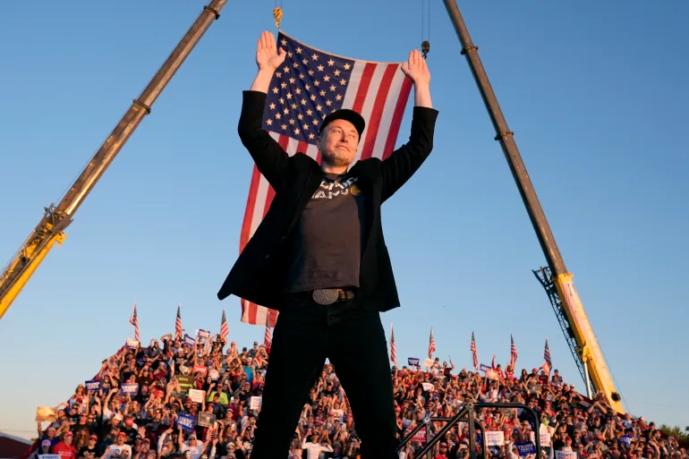 Tesla and SpaceX CEO Elon Musk walks to the stage to speak alongside Republican presidential nominee Donald Trump at a campaign event in Butler, Pennsylvania, on October 5 [Alex Brandon/AP]