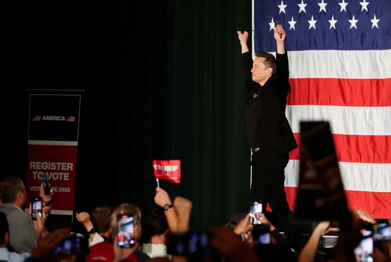 Tesla CEO and X owner Elon Musk, who supports Donald Trump, appears on stage during an America PAC town hall in Folsom, Pennsylvania, on October 17, 2024