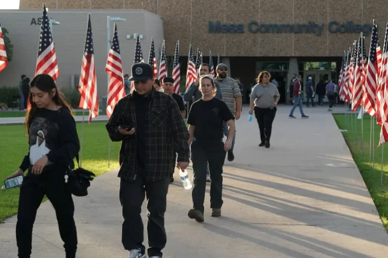 Voters walk out of a polling station outside Mesa Community College in Mesa, Arizona, on November 5