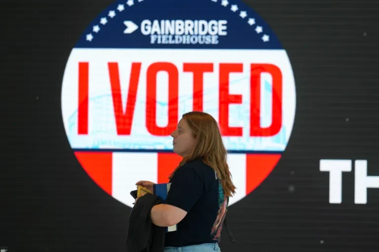 A voter waits to check in to vote at Gainbridge Fieldhouse in Indianapolis on Election Day