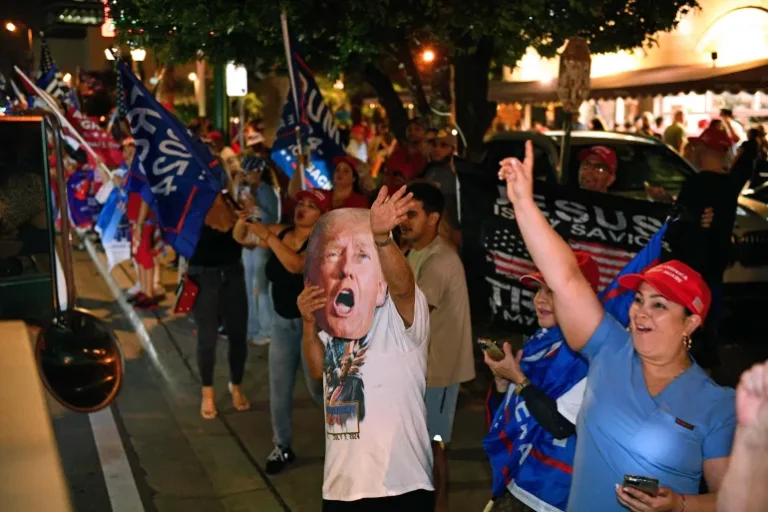 Supporters of former US President and current president elect Donald Trump celebrate outside Versailles Cuban restaurant in Miami, Florida on November 5, 2024.